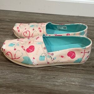 Toms slip on Nurse theme shoes